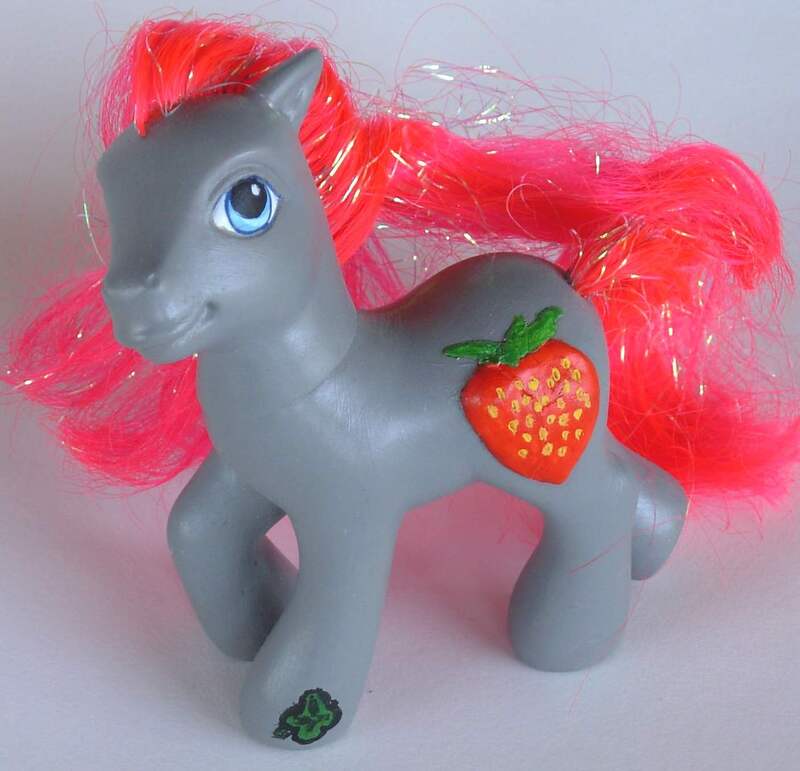 A gray G3 MLP with red hair, blue eyes, and a 3D hand sculpted strawberry for his cutie mark