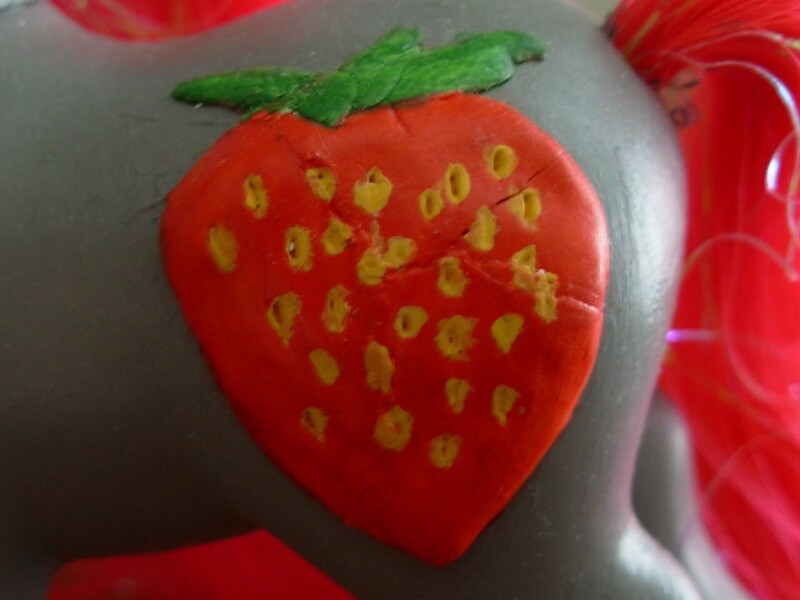 A 3D hand sculpted strawberry is his cutie mark